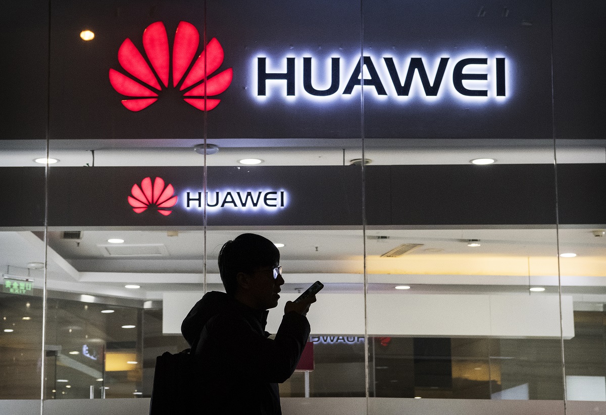 A pedestrian talks on the phone while walking past a Huawei Technologies Co. store on January 29, 2019 in Beijing, China. The U.S. Justice Department filed a host of criminal charges against Chinese telecoms giant Huawei and its chief financial officer, Meng Wanzhou, including bank fraud, violating sanctions on Iran, and stealing robotic technology. Huawei denied committing any of the violations and rejected criminal claims against Meng, the daughter of Huawei founder Ren Zhengfei, who was arrested in Canada in December last year